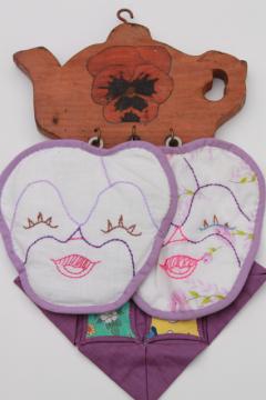 1930s vintage embroidered pansy flower faces potholders on painted pansies wood wall rack