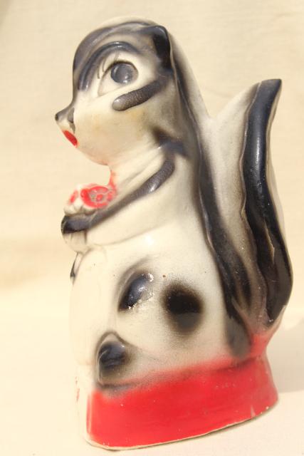 1940s vintage carnival chalkware bank, Flower the skunk painted plaster figure