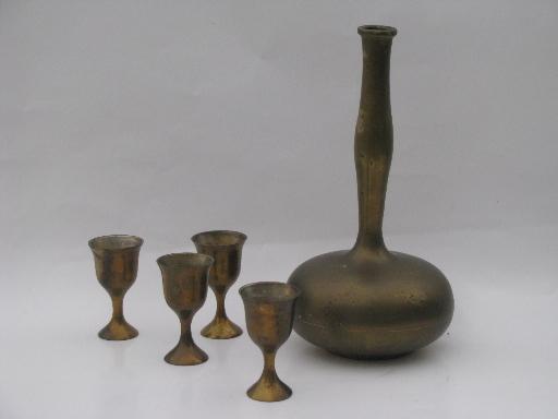 60s vintage solid brass genie bottle decanter and small goblet glasses
