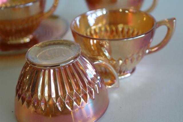 Anniversary pattern iridescent carnival glass cups and saucers marigold orange luster