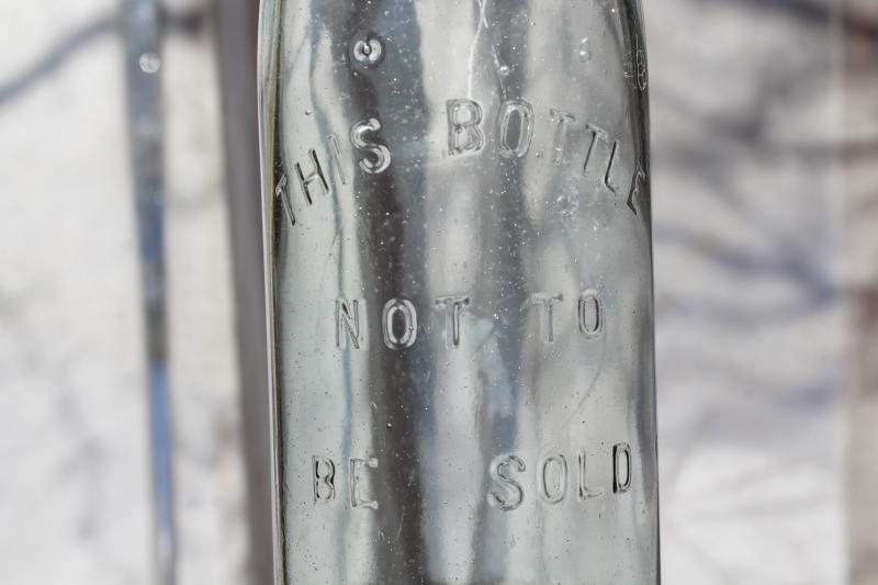 This Bottle Not To Be Sold vintage bail lid embossed glass bottle