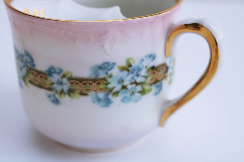 Victorian era antique china mustache cup marked Germany, forget me nots floral on pink w/ gold