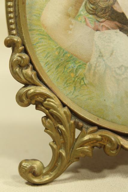 antique gilt picture frame w/ litho print young girl, small round ornate embossed brass frame