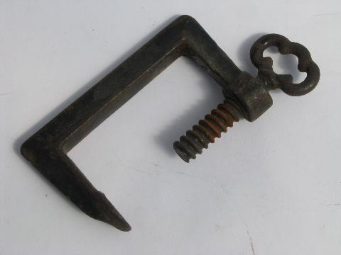 antique iron clamp for kitchen or farm tools, clamps to table or work bench
