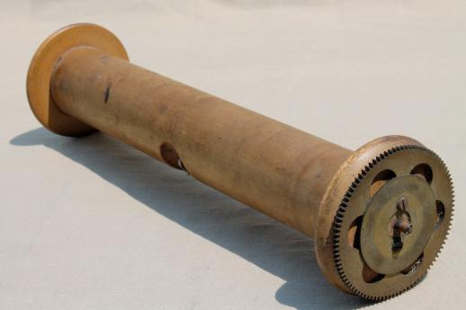 antique player piano roller, large wooden spool to hold paper piano rolls