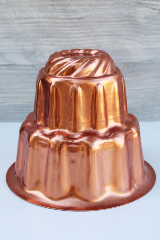 bright copper color vintage aluminum mold, tall tiered shape jello mold pan