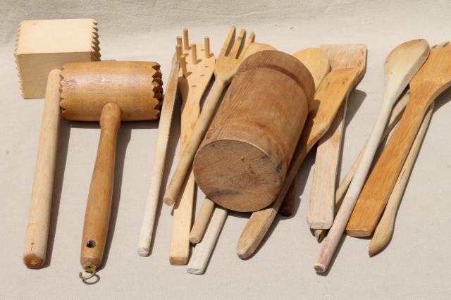 collection of vintage wooden kitchen utensils, wood spoons, meat tenderizer mallets