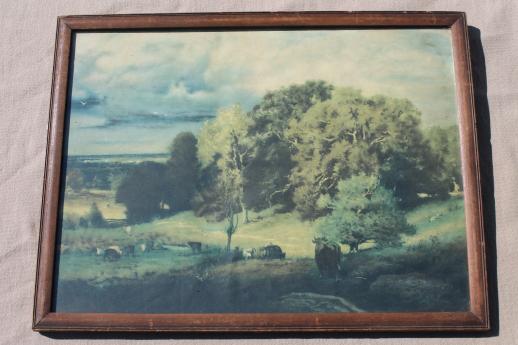 faded vintage print, pastoral landscape scene cows on pasture in shabby wood picture frame