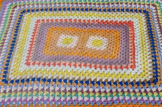 giant crochet granny square afghan in a rainbow of retro colored scrap yarn