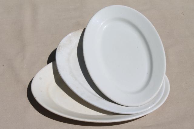 graduated sizes stack of old antique vintage white ironstone china platters