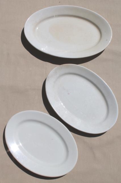 graduated sizes stack of old antique vintage white ironstone china platters