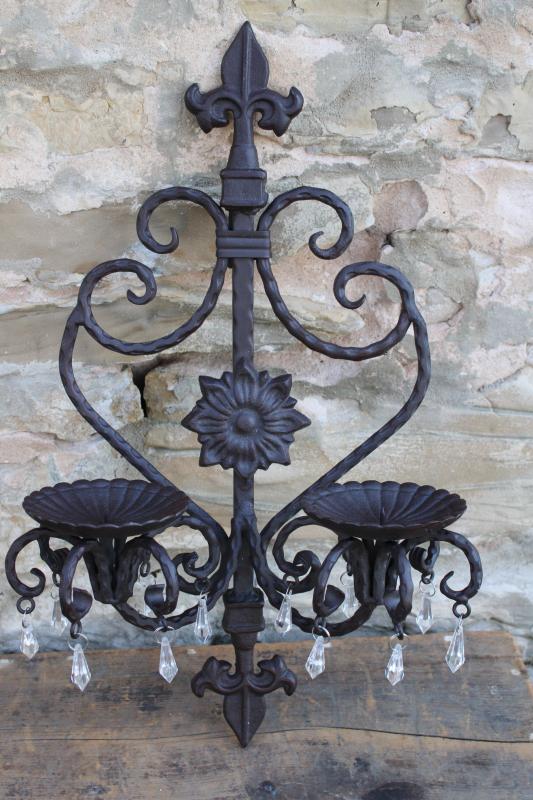 heavy cast iron wall sconces, French country fleur de lis architectural decor