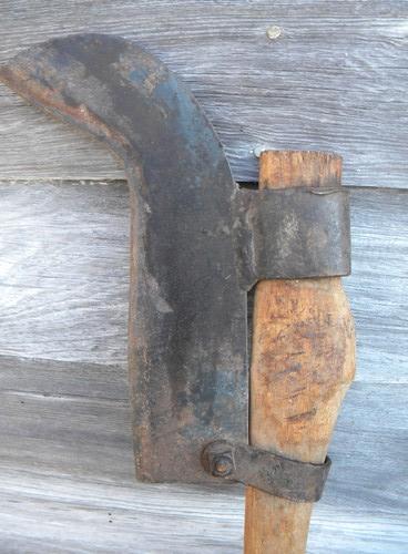 large old vintage billhook or brush axe, primitive farm tool