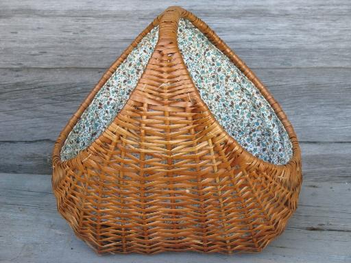 lined rattan or wicker knitting basket, old blue print cotton fabric