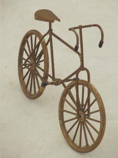 miniature brass bicycle with working wheels, machine age steampunk style!