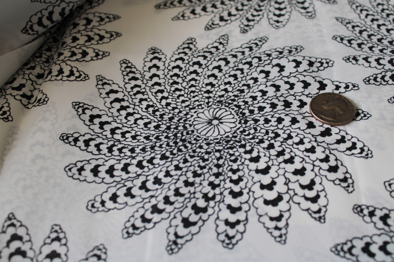 modernist print black on white silky poly fabric, large mandalas or flower whorls