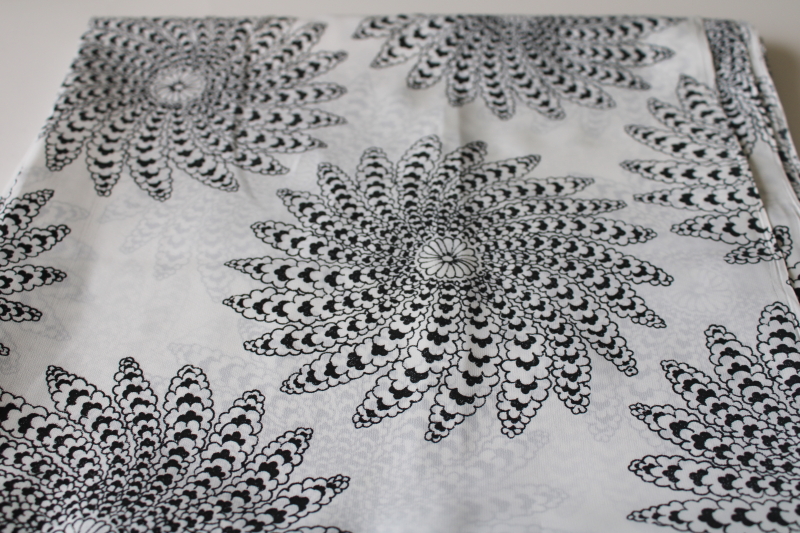 modernist print black on white silky poly fabric, large mandalas or flower whorls