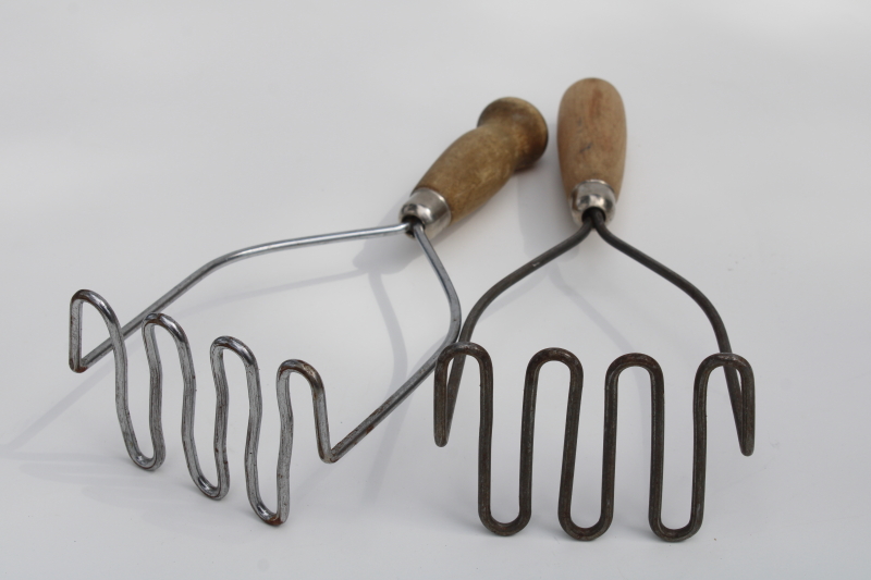 natural worn wood handled potato mashers, old kitchen utensils, 1930s vintage kitchenware