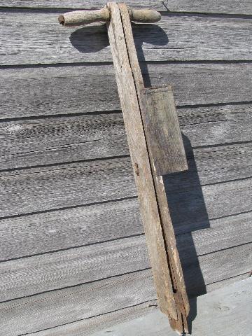 old antique farm tool, hand corn seeder, primitive garden planter