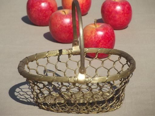 old brass basket full of autumn apples, rustic fruit centerpiece for fall 