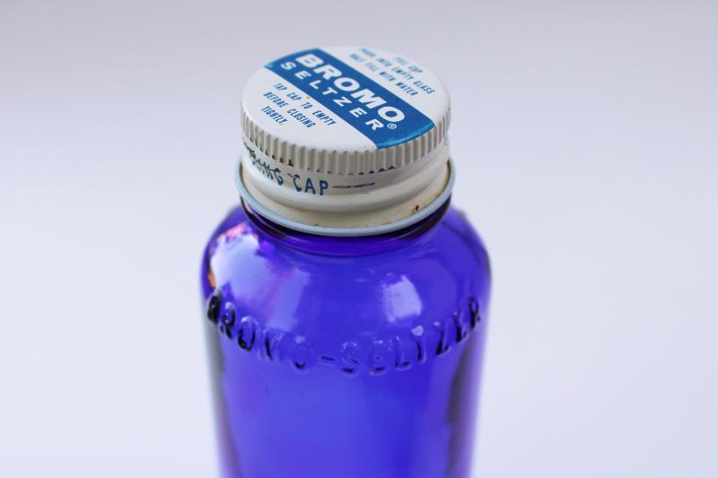 old cobalt blue glass medicine bottles, embossed Bromo-Seltzer, vintage Milk of Magnesia