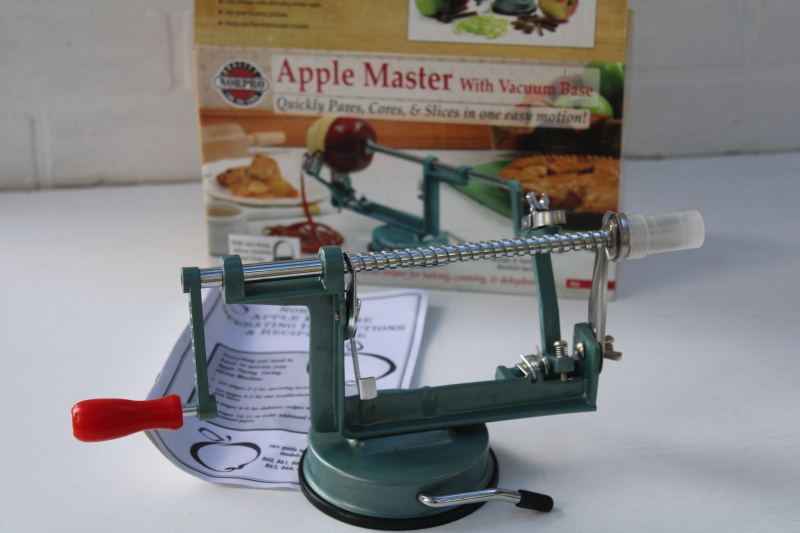 old fashioned green metal hand crank apple peeler corer slicer, vintage style kitchen tool