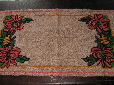 old flowered hooked rug, wool yarn
