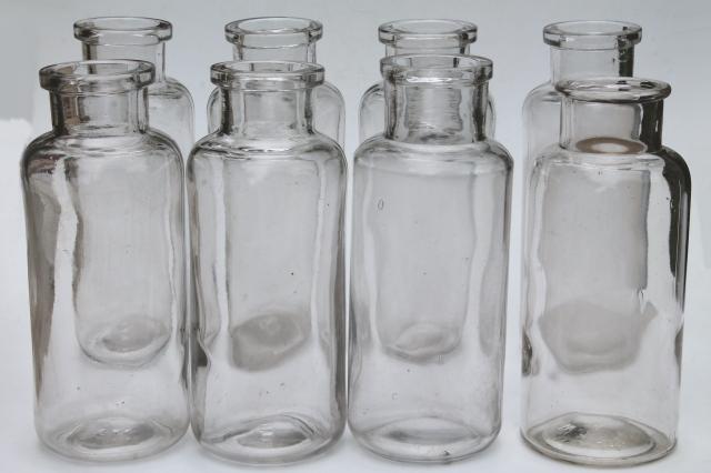 old glass apothecary bottles, vintage clear glass jars, tall canister bottle lot