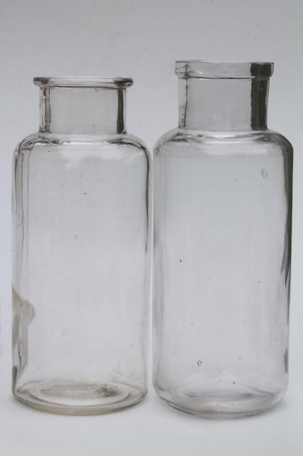 old glass apothecary bottles, vintage clear glass jars, tall canister bottle lot