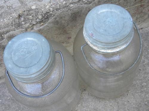 old glass honey jars w/metal caps and wire handles for pantry storage