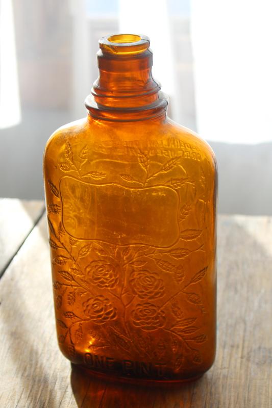 old glass liquor bottles, fancy embossed pattern glass wine & whiskey bottle flasks
