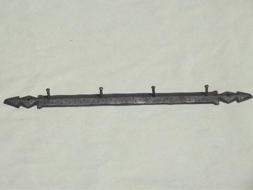 old hanging rack for kitchen utensils, wall mount cast iron peg board
