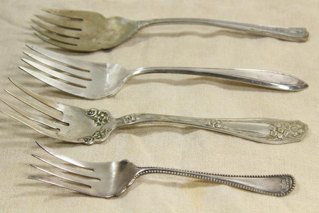 ornate antique silverware, collection of large serving forks, vintage silver plate flatware