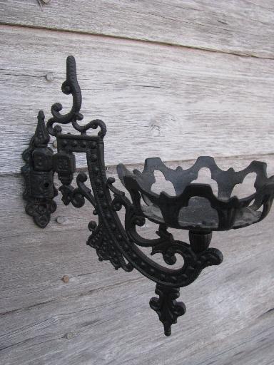 ornate oil lamp holder wall brackets, vintage cast metal marked Emig