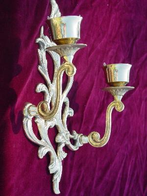 pair of solid brass candle sconces with ornate scrolls