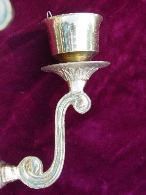 pair of solid brass candle sconces with ornate scrolls