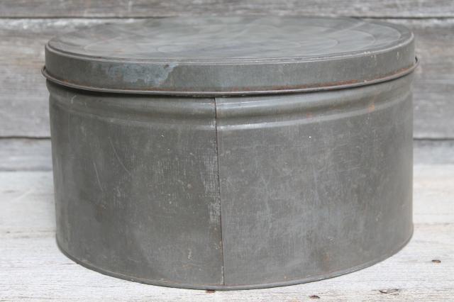 primitive old antique metal cracker box or cake tin, large round hatbox shape
