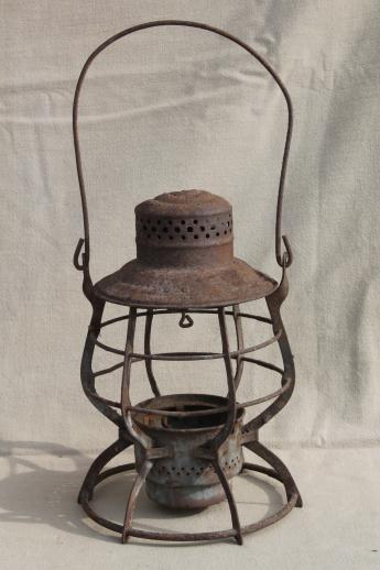 primitive rusty old railroad lantern, old iron lamp cage without glass shade