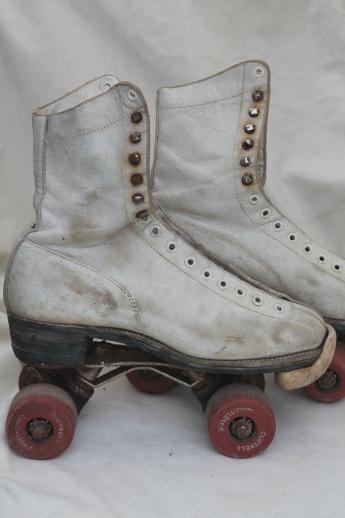 retro vintage roller skates w/ leather boots, very rough, great garden flower planters!