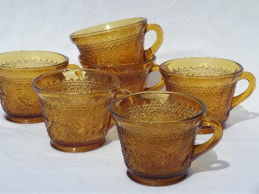 set 6 footed cups, vintage Tiara amber glass sandwich daisy pattern