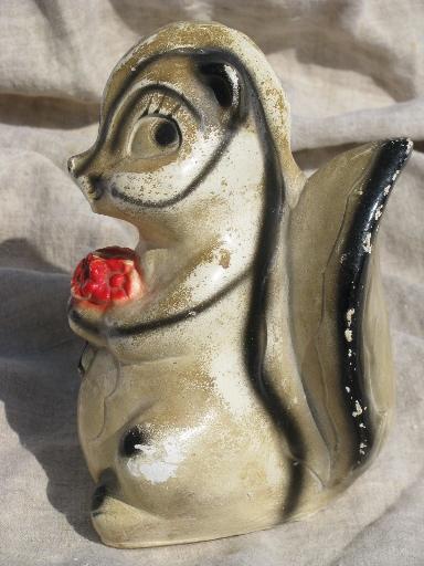 skunk w/ flowers, 30s vintage hand-painted carnival chalkware novelty bank
