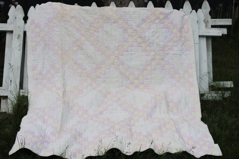soft faded vintage hand stitched cotton quilt, patchwork blocks pink, butter yellow, white