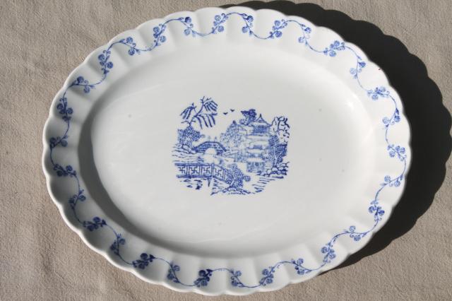 stack of vintage blue willow oval platters, blue and white chinoiserie china
