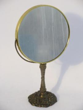 vintage cast metal magnifying shaving or vanity mirror on stand, antique brass finish