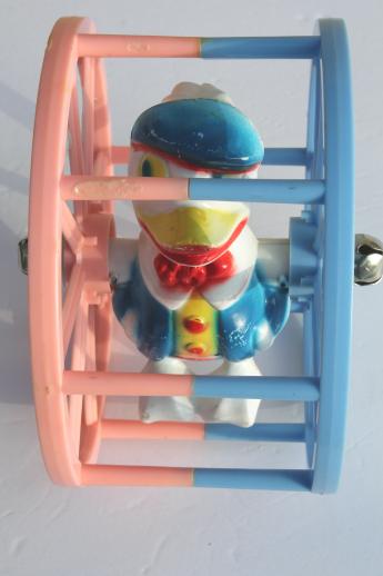 vintage celluloid plastic baby toy, sailor duck spinner wheel rolling push toy