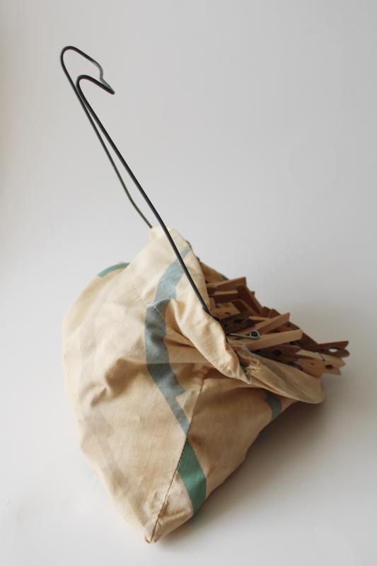 vintage clothespin bag full of old wood clothespins, wire hanger for laundry wash line