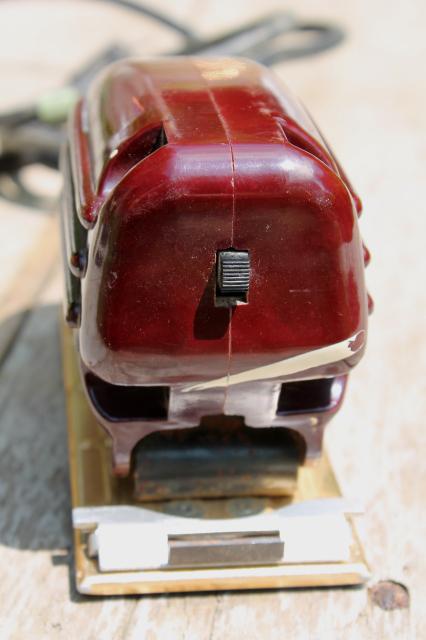 vintage electric palm sander, 1950s red bakelite woodworking power tool