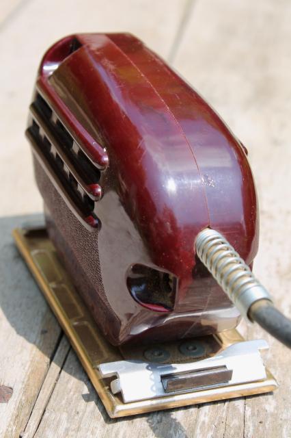 vintage electric palm sander, 1950s red bakelite woodworking power tool