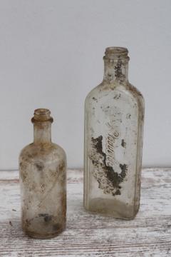 vintage embossed glass medicine bottles, spooky old dug bottles for creepy haunted Halloween