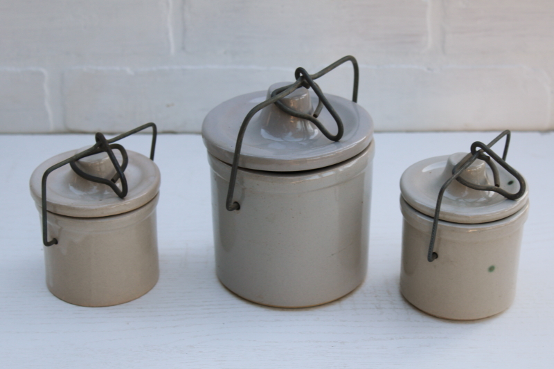 vintage farmhouse decor, old white stoneware crock jars, cheese crocks w/ wire bails and lids